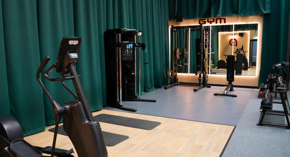 Acoustic curtains dividing the gym area from the padel courts at Performance Padel